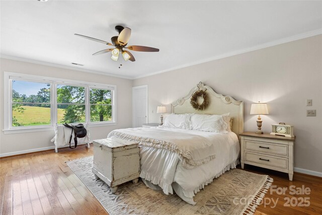 310 Southwood Ln, Columbus, NC 28722 - bedroom featuring ornamental molding, hardwood / wood-style floors, and a ceiling fan