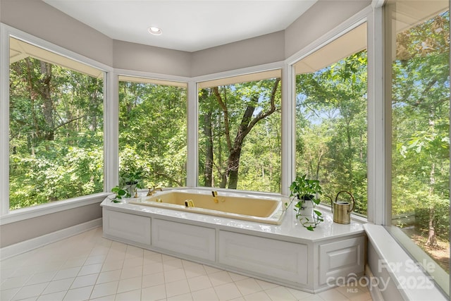 310 Southwood Ln, Columbus, NC 28722 - full bath with a tub with jets, tile patterned flooring, plenty of natural light, and view of wooded area