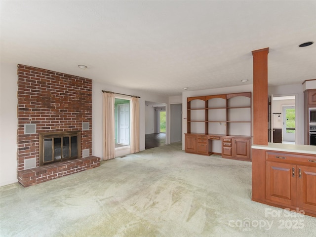 202 Terrell Rd, Clyde, NC 28721 - unfurnished living room featuring light carpet and a fireplace