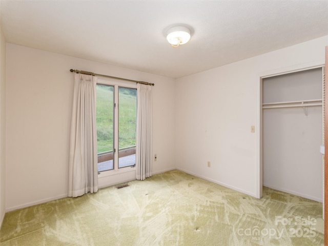 202 Terrell Rd, Clyde, NC 28721 - unfurnished bedroom featuring carpet, baseboards, and a closet