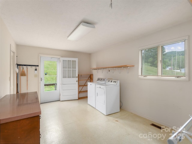 202 Terrell Rd, Clyde, NC 28721 - laundry area featuring washer and clothes dryer and baseboards