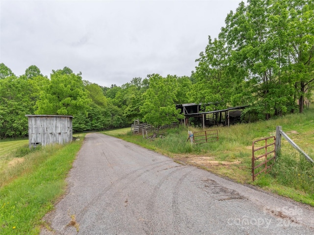 202 Terrell Rd, Clyde, NC 28721 - view of asphalt road featuring a forest view