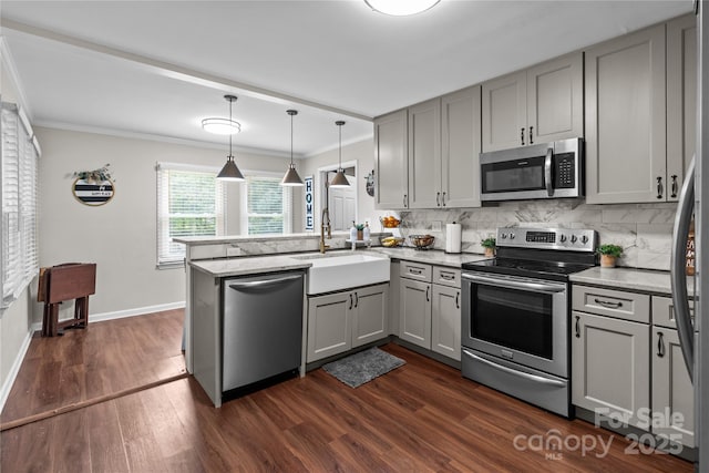 2146 Marwood Ln, Albemarle, NC 28001 - kitchen with stainless steel appliances, gray cabinets, a peninsula, tasteful backsplash, and crown molding