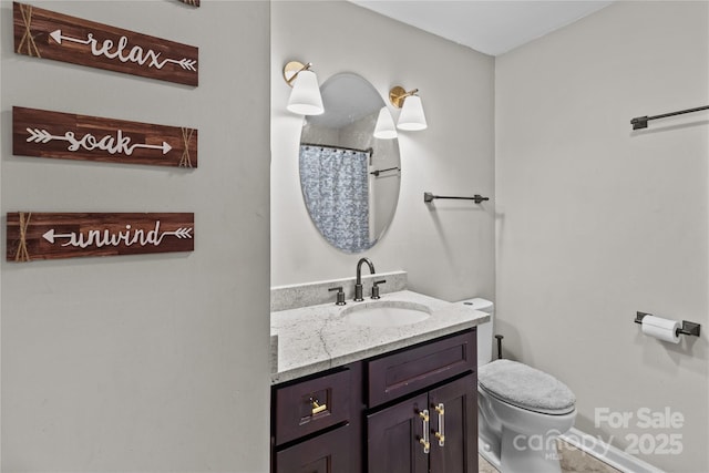 2146 Marwood Ln, Albemarle, NC 28001 - full bath featuring vanity, toilet, baseboards, and curtained shower