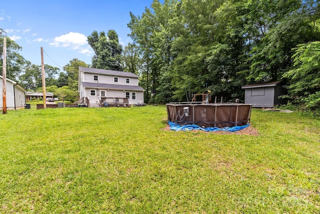 2146 Marwood Ln, Albemarle, NC 28001 - view of green lawn featuring an outdoor pool and a deck