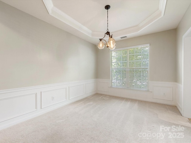 8603 Robinson Meadow Ct, Charlotte, NC 28277 - spare room featuring ornamental molding, a raised ceiling, light carpet, a chandelier, and a wainscoted wall