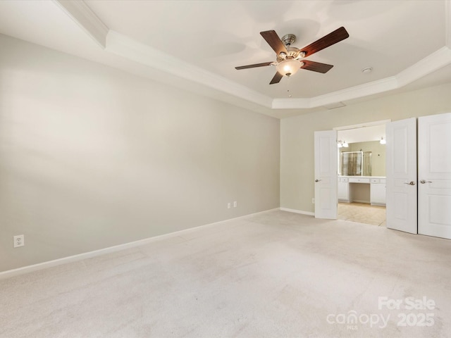 8603 Robinson Meadow Ct, Charlotte, NC 28277 - spare room with a tray ceiling, crown molding, light carpet, and a ceiling fan