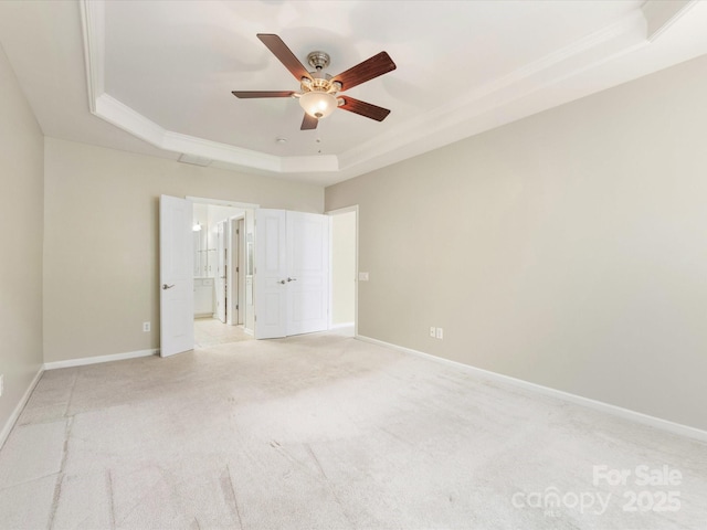 8603 Robinson Meadow Ct, Charlotte, NC 28277 - unfurnished bedroom featuring a raised ceiling, light colored carpet, connected bathroom, crown molding, and a ceiling fan