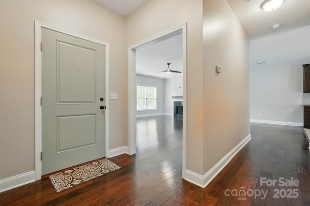 6618 Alexander Rd, Charlotte, NC 28270 - entryway with dark wood-style flooring, baseboards, a ceiling fan, and a tile fireplace