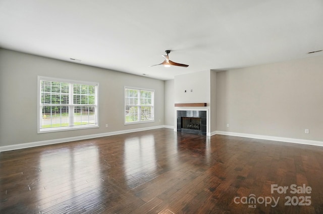 6618 Alexander Rd, Charlotte, NC 28270 - unfurnished living room with a ceiling fan, dark wood-style flooring, baseboards, and a tile fireplace