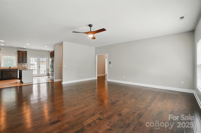 6618 Alexander Rd, Charlotte, NC 28270 - unfurnished living room with ceiling fan, dark wood-style flooring, baseboards, recessed lighting, and a sink