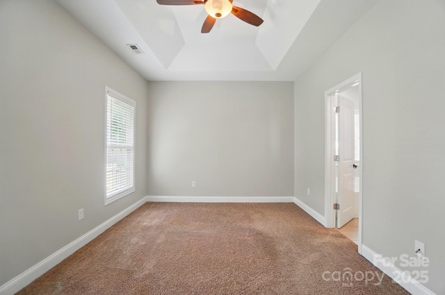 6618 Alexander Rd, Charlotte, NC 28270 - empty room featuring a ceiling fan, a raised ceiling, light carpet, and baseboards