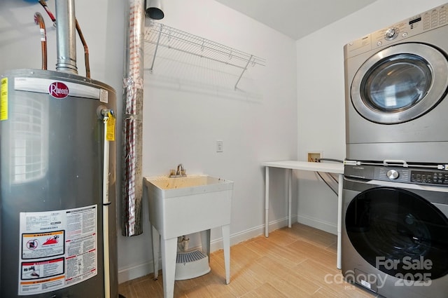6618 Alexander Rd, Charlotte, NC 28270 - laundry room with gas water heater, stacked washer and clothes dryer, and baseboards