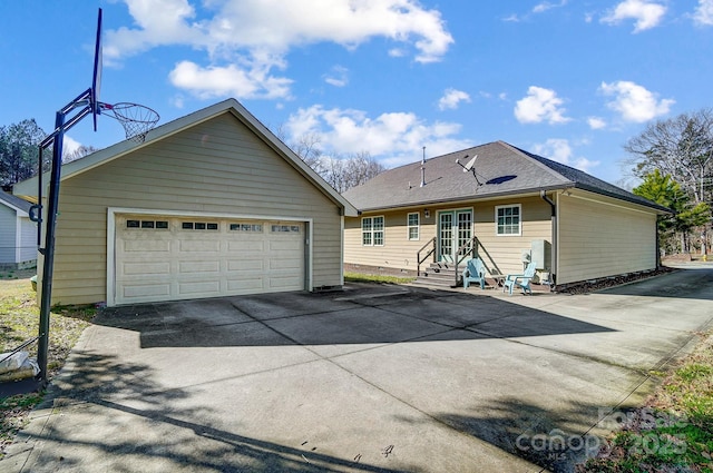 6618 Alexander Rd, Charlotte, NC 28270 - rear view of house with entry steps, a detached garage, and a shingled roof