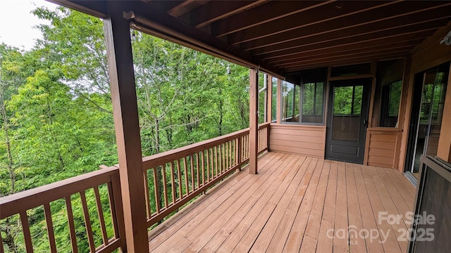105 Toxaway Views Dr Unit 402, Lake Toxaway, NC 28747 - wooden terrace featuring a wooded view