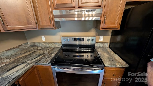 105 Toxaway Views Dr Unit 402, Lake Toxaway, NC 28747 - kitchen featuring exhaust hood, stainless steel electric range oven, freestanding refrigerator, and brown cabinets