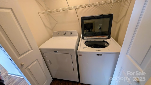 105 Toxaway Views Dr Unit 402, Lake Toxaway, NC 28747 - laundry area featuring washer and dryer and dark wood-style floors