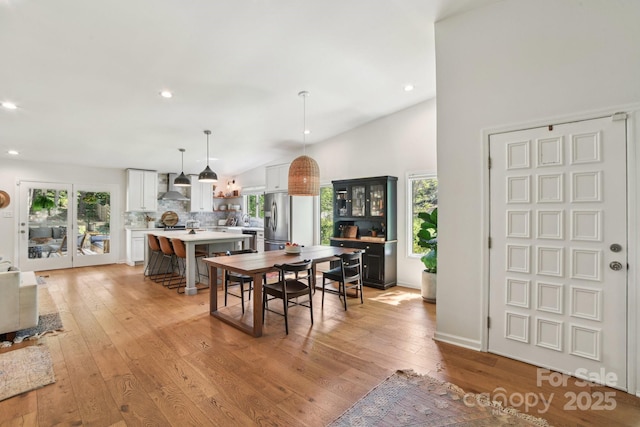 5 Lowry Ln, Weaverville, NC 28787 - dining room featuring light wood finished floors, healthy amount of natural light, recessed lighting, and lofted ceiling