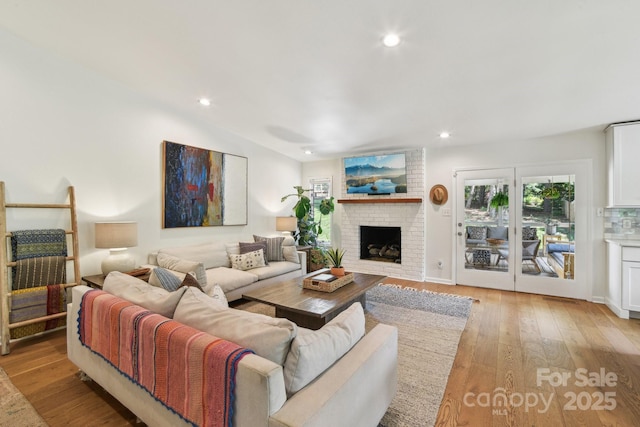 5 Lowry Ln, Weaverville, NC 28787 - living area featuring a brick fireplace, light wood-style flooring, and recessed lighting