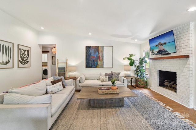 5 Lowry Ln, Weaverville, NC 28787 - living room featuring washer / clothes dryer, wood finished floors, a fireplace, and recessed lighting