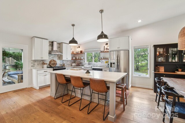 5 Lowry Ln, Weaverville, NC 28787 - kitchen with wall chimney range hood, appliances with stainless steel finishes, open shelves, light countertops, and recessed lighting