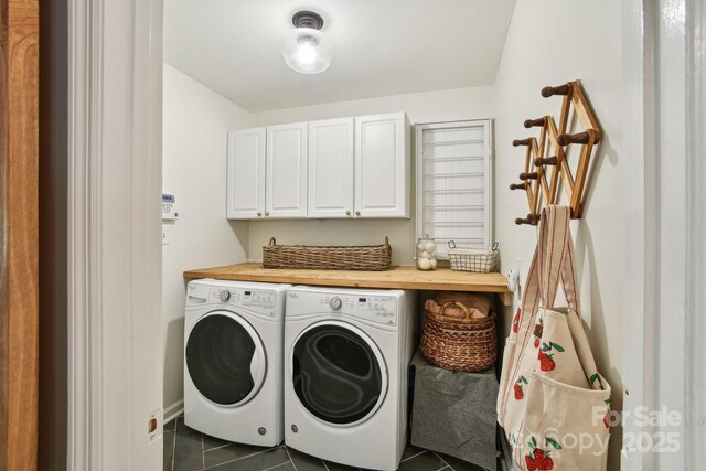 5 Lowry Ln, Weaverville, NC 28787 - washroom featuring cabinet space, dark tile patterned floors, and washing machine and clothes dryer