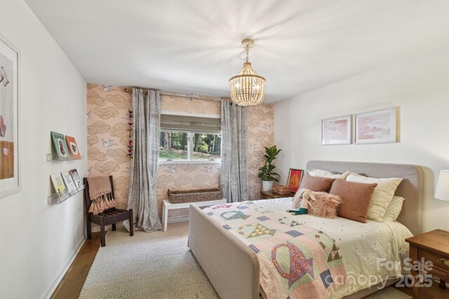 5 Lowry Ln, Weaverville, NC 28787 - bedroom featuring a chandelier, baseboards, and wood finished floors