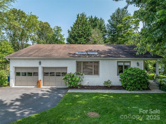 5 Lowry Ln, Weaverville, NC 28787 - single story home with brick siding, an attached garage, a front yard, and driveway