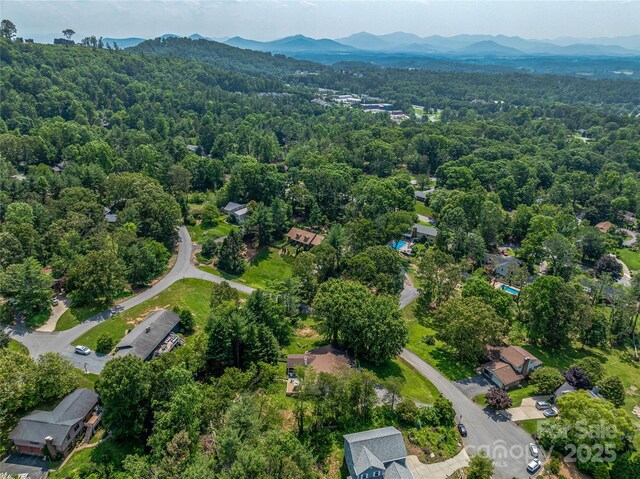 5 Lowry Ln, Weaverville, NC 28787 - aerial view of property's location with a heavily wooded area and a mountainous background