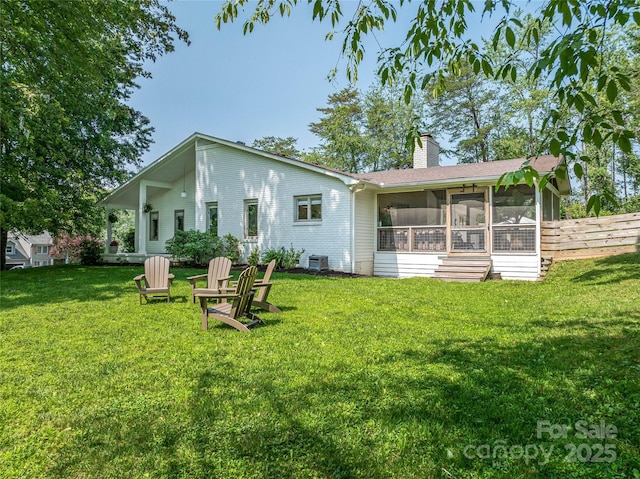 5 Lowry Ln, Weaverville, NC 28787 - back of house with a sunroom, a chimney, and central AC