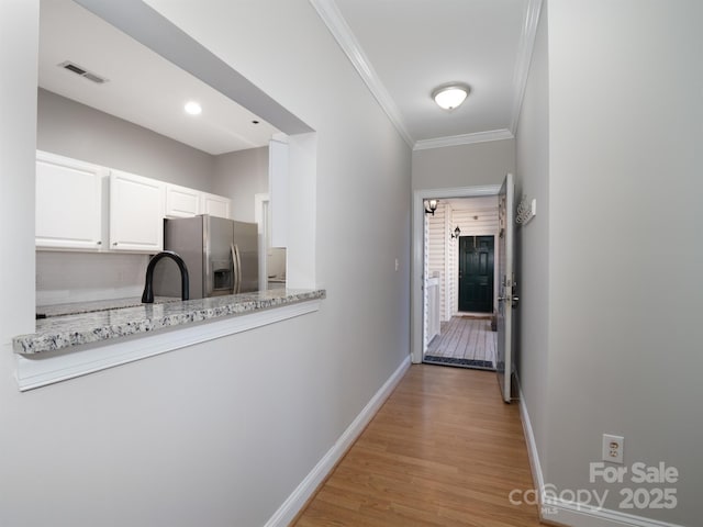 5617 Fairview Rd Unit 9, Charlotte, NC 28209 - hallway featuring ornamental molding and light wood-style floors