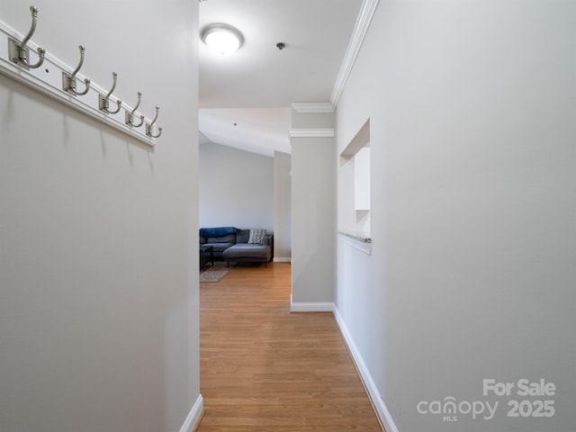 5617 Fairview Rd Unit 9, Charlotte, NC 28209 - corridor featuring ornamental molding, light wood finished floors, and vaulted ceiling