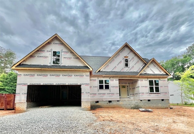1143 Journey Ln, Salisbury, NC 28146 - property in mid-construction featuring crawl space, gravel driveway, roof with shingles, and an attached garage