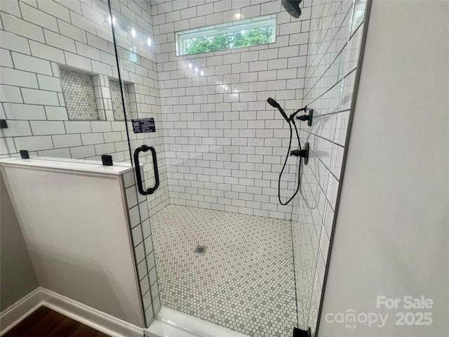 1143 Journey Ln, Salisbury, NC 28146 - bathroom featuring a shower stall, wood finished floors, and baseboards