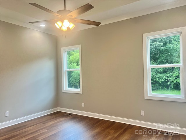 1143 Journey Ln, Salisbury, NC 28146 - unfurnished room featuring healthy amount of natural light, baseboards, dark wood finished floors, ceiling fan, and recessed lighting