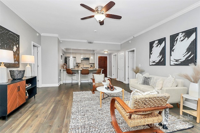 300 W 5th St Unit 003, Charlotte, NC 28202 - living area featuring a ceiling fan, ornamental molding, and dark wood finished floors