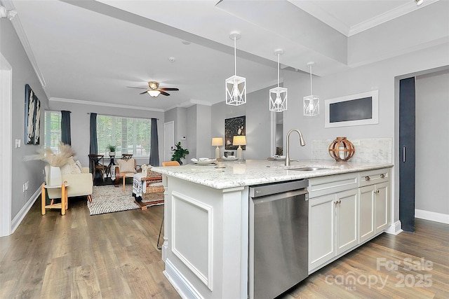 300 W 5th St Unit 003, Charlotte, NC 28202 - kitchen with stainless steel dishwasher, crown molding, wood finished floors, white cabinets, and light stone counters