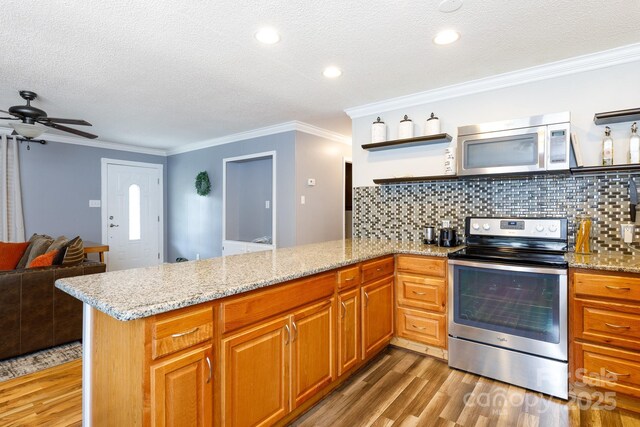 1197 Fincher Rd, Fort Lawn, SC 29714 - kitchen featuring appliances with stainless steel finishes, open shelves, a peninsula, light wood-style floors, and a textured ceiling