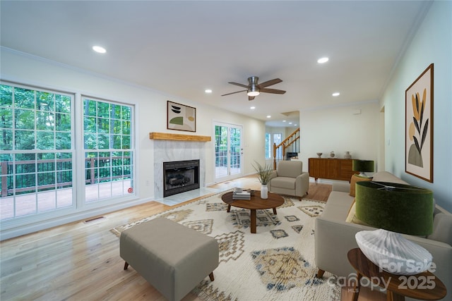114 Coachmans Trl, Asheville, NC 28803 - living room with stairs, ornamental molding, wood finished floors, recessed lighting, and a premium fireplace