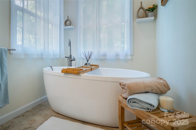 114 Coachmans Trl, Asheville, NC 28803 - bathroom featuring a freestanding bath and tile patterned flooring