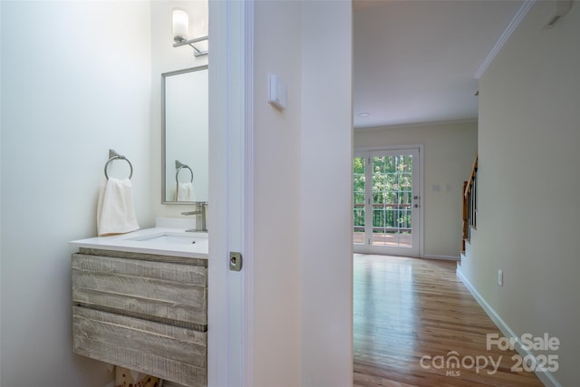114 Coachmans Trl, Asheville, NC 28803 - bathroom with ornamental molding, wood finished floors, and vanity