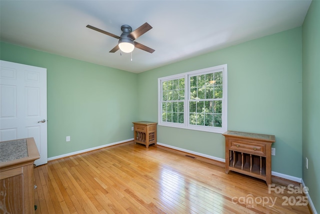 114 Coachmans Trl, Asheville, NC 28803 - empty room with a ceiling fan and light wood finished floors