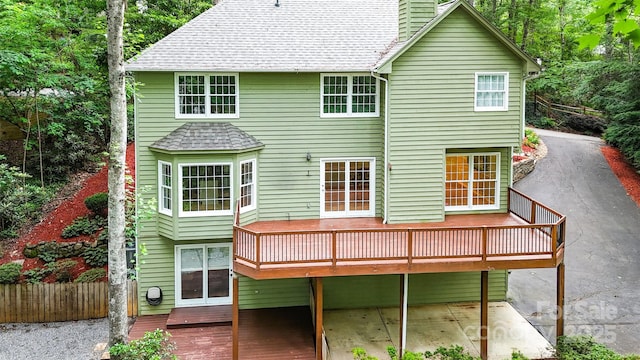 114 Coachmans Trl, Asheville, NC 28803 - back of property with a deck, a chimney, and roof with shingles