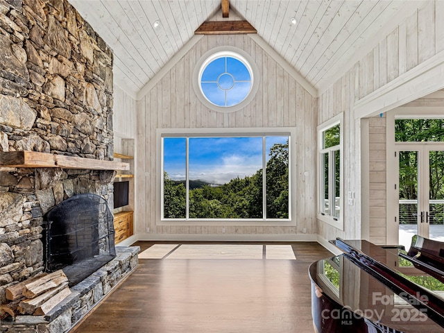 251 Toxaway Ct, Lake Toxaway, NC 28747 - living room featuring high vaulted ceiling, wood finished floors, wood walls, french doors, and a fireplace