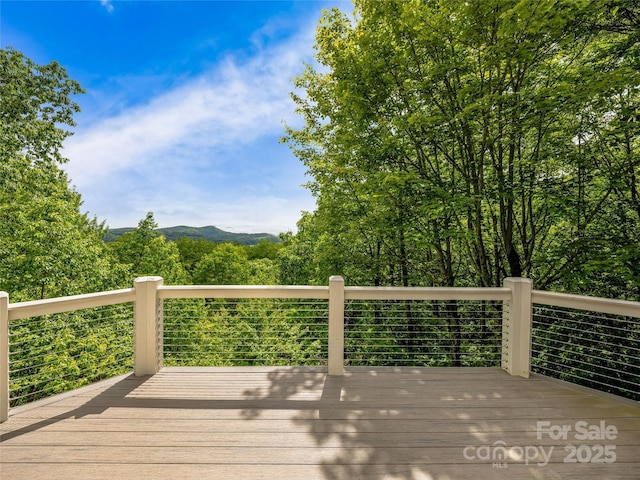 251 Toxaway Ct, Lake Toxaway, NC 28747 - wooden terrace with a mountain view