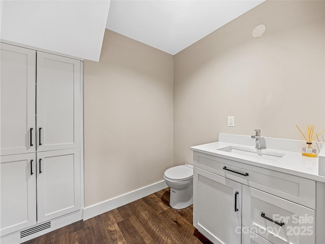 251 Toxaway Ct, Lake Toxaway, NC 28747 - bathroom with toilet, wood finished floors, vanity, and baseboards