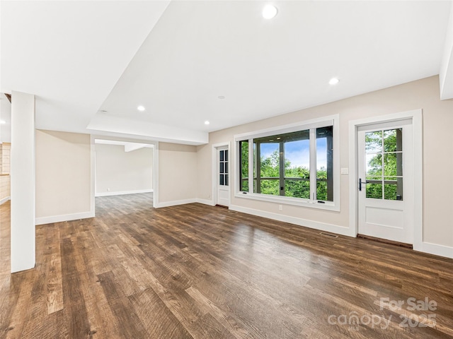 251 Toxaway Ct, Lake Toxaway, NC 28747 - unfurnished living room with wood finished floors, plenty of natural light, baseboards, and recessed lighting