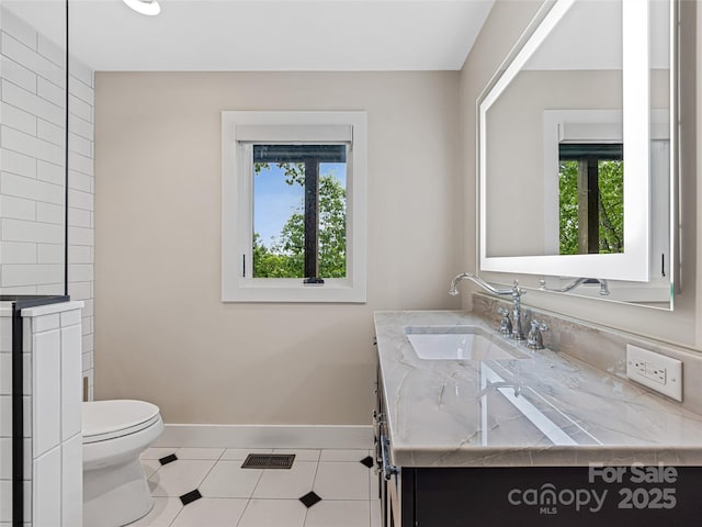 251 Toxaway Ct, Lake Toxaway, NC 28747 - bathroom featuring healthy amount of natural light, vanity, toilet, and baseboards