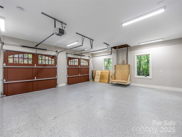 251 Toxaway Ct, Lake Toxaway, NC 28747 - garage with a garage door opener and baseboards