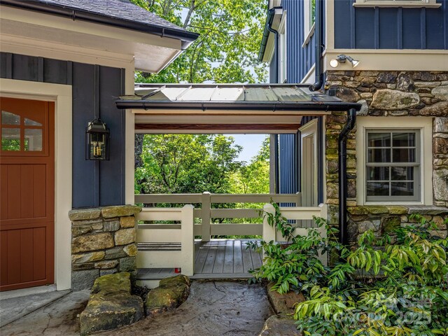 251 Toxaway Ct, Lake Toxaway, NC 28747 - property entrance featuring stone siding and board and batten siding